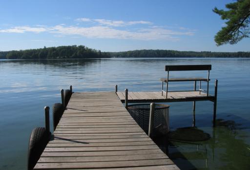 pond dock with a bench